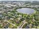 Overhead view of the property near a lake and commercial buildings at 8120 Gondola Dr, Orlando, FL 32809