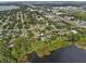 Aerial shot of the property near a lake, with a pool in the backyard at 8120 Gondola Dr, Orlando, FL 32809