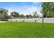 A backyard volleyball net is strung with a covered patio in the background at 8120 Gondola Dr, Orlando, FL 32809