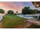 The backyard includes a pool, large green area, and partial fencing at 8120 Gondola Dr, Orlando, FL 32809