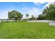 Green backyard with a volleyball net for outdoor enjoyment at 8120 Gondola Dr, Orlando, FL 32809