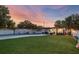 This backyard features a pool, a covered patio, and a well-maintained lawn at 8120 Gondola Dr, Orlando, FL 32809