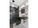 Modern bathroom features a unique black toilet and sink, sleek gold fixtures, and tiled walk-in shower at 8120 Gondola Dr, Orlando, FL 32809