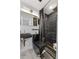 Chic bathroom features sleek black fixtures, modern tiling, and stylish gold accents at 8120 Gondola Dr, Orlando, FL 32809