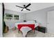 Cozy bedroom features marble floors, a ceiling fan, and a comfortable queen-sized bed at 8120 Gondola Dr, Orlando, FL 32809