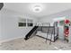 bedroom featuring bunk beds with a slide and storage shelves for toys and books at 8120 Gondola Dr, Orlando, FL 32809