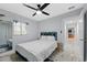 Bright bedroom with a cozy bed, enhanced by ample natural light and a view to the outside at 8120 Gondola Dr, Orlando, FL 32809
