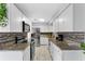 Contemporary kitchen with granite countertops, stainless steel appliances, and stylish backsplash at 8120 Gondola Dr, Orlando, FL 32809