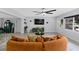 Comfortable open-plan living room with modern decor, with access to dining area at 8120 Gondola Dr, Orlando, FL 32809