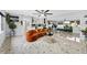 Bright, open living room with modern decor, marble floors, and neutral paint at 8120 Gondola Dr, Orlando, FL 32809