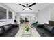 Bright living room featuring marble floors, modern decor, and ample natural light from large windows at 8120 Gondola Dr, Orlando, FL 32809