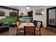 Inviting outdoor patio with a dining set overlooking a serene backyard and pool, perfect for entertaining at 8120 Gondola Dr, Orlando, FL 32809
