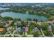 Aerial view of homes near the lake shows proximity to water and the city skyline at 830 Oak St, Orlando, FL 32804