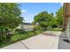Balcony view of lush greenery, mature trees, and a backyard oasis at 830 Oak St, Orlando, FL 32804