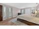 Bright bedroom with hardwood floors, tan walls, and lots of natural light at 830 Oak St, Orlando, FL 32804