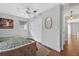 Neutral bedroom featuring wood floors, closet, and a gold framed mirror at 830 Oak St, Orlando, FL 32804