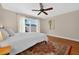 Sunlit bedroom with hardwood floors and sliding glass doors at 830 Oak St, Orlando, FL 32804