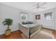 Comfortable bedroom featuring a daybed, hardwood floors, natural light, and a ceiling fan at 830 Oak St, Orlando, FL 32804