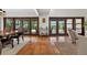 Bright dining area features tile floors, wooden framed sliding glass doors and access to the backyard at 830 Oak St, Orlando, FL 32804