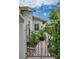 An ornate wrought iron gate opening to a lush garden path at 830 Oak St, Orlando, FL 32804