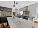 Bright kitchen featuring stainless steel appliances, a large center island, and dark wood cabinetry at 830 Oak St, Orlando, FL 32804