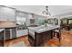 Open concept kitchen with a center island, stainless steel appliances, and subway tile backsplash at 830 Oak St, Orlando, FL 32804