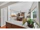 Bright, open kitchen with stainless steel appliances, a center island, and white cabinetry at 830 Oak St, Orlando, FL 32804