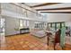 Open-concept floor plan featuring terracotta tile floors, balcony and natural light at 830 Oak St, Orlando, FL 32804