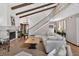 Bright living room features a fireplace, exposed beams, and staircase at 830 Oak St, Orlando, FL 32804