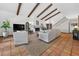 Bright living room features a fireplace, exposed beams, staircase, and tile floors at 830 Oak St, Orlando, FL 32804