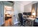 Home office featuring desk with dual monitors and a view into the bedroom at 830 Oak St, Orlando, FL 32804