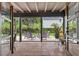 Covered patio with tile floors and backyard access at 830 Oak St, Orlando, FL 32804