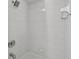 Clean white-tiled shower equipped with a rainfall shower head and convenient soap dish at 830 Oak St, Orlando, FL 32804