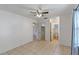 Bedroom featuring tile flooring, ceiling fan, natural lighting, and closet access at 856 Mendoza Dr, Kissimmee, FL 34758