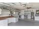 Organized garage with laundry area, ample storage cabinets, and counter workspace at 856 Mendoza Dr, Kissimmee, FL 34758