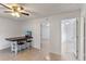 Cozy living room featuring tiled floors, a kitchen bar with seating, and access to other rooms at 856 Mendoza Dr, Kissimmee, FL 34758