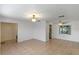 This living room offers tile flooring, natural lighting, and an open floorplan at 856 Mendoza Dr, Kissimmee, FL 34758