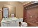 Bathroom with a vanity, toilet, mirror, and tiled shower at 874 Quarters Ct, Port Orange, FL 32129