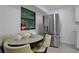 Cozy dining area featuring a stainless steel refrigerator next to a window with natural light at 874 Quarters Ct, Port Orange, FL 32129