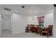 Cozy dining area with elegant chandelier, tiled floors, and view of the outside at 874 Quarters Ct, Port Orange, FL 32129