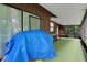 Spacious enclosed sunroom with wood paneling, perfect for relaxing or entertaining guests at 874 Quarters Ct, Port Orange, FL 32129