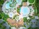 Overhead shot of the Oasis Club House featuring pools, lounge areas, and well-manicured landscaping at 8961 Cabot Cliffs Dr, Davenport, FL 33896