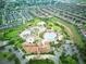 Aerial view of residential area showcasing community's Oasis Club House with multiple pools and amenities at 8961 Cabot Cliffs Dr, Davenport, FL 33896