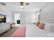 Bright bedroom with a queen bed, dresser and closet at 8961 Cabot Cliffs Dr, Davenport, FL 33896