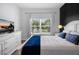 Serene bedroom featuring ample natural light and minimalist decor at 8961 Cabot Cliffs Dr, Davenport, FL 33896