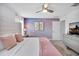 Bedroom with a queen bed, dresser and cloud wall decor at 8961 Cabot Cliffs Dr, Davenport, FL 33896