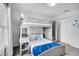 Stylish bedroom featuring a bunk bed with a gray frame and a plush blue blanket at 8961 Cabot Cliffs Dr, Davenport, FL 33896