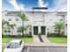 Contemporary townhome featuring clean lines, well-maintained landscaping, and a convenient parking space at 8961 Cabot Cliffs Dr, Davenport, FL 33896