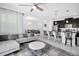 Bright living area features modern furnishings, breakfast bar, and seamless flow to the dining area at 8961 Cabot Cliffs Dr, Davenport, FL 33896