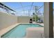 Screened-in pool area with lounge chairs and a grill for outdoor entertaining at 8961 Cabot Cliffs Dr, Davenport, FL 33896